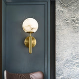 Modern Alabaster Globe Wall Sconce with Brushed Brass Finish